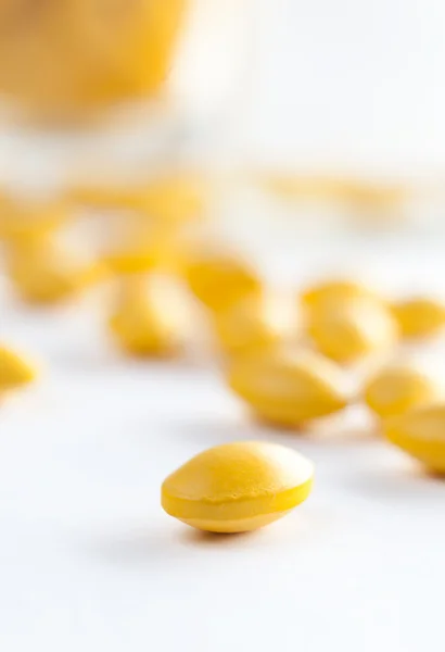 Close up of yellow colored pills — Stock Photo, Image