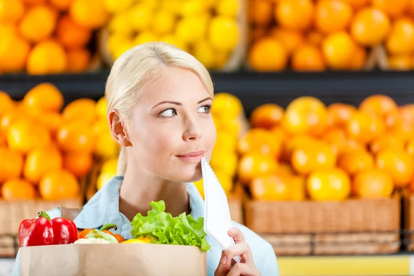 Girl hands package with fresh vegetables — Stock Photo, Image