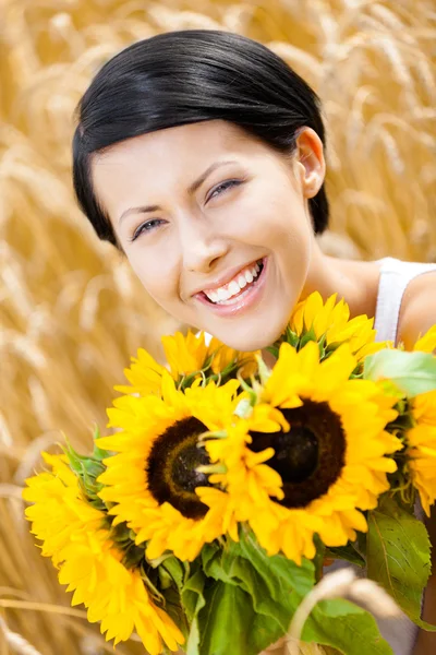 Young girl with sunflowers — Stock Photo, Image