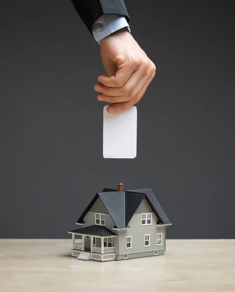 Close up of little home and hand — Stock Photo, Image