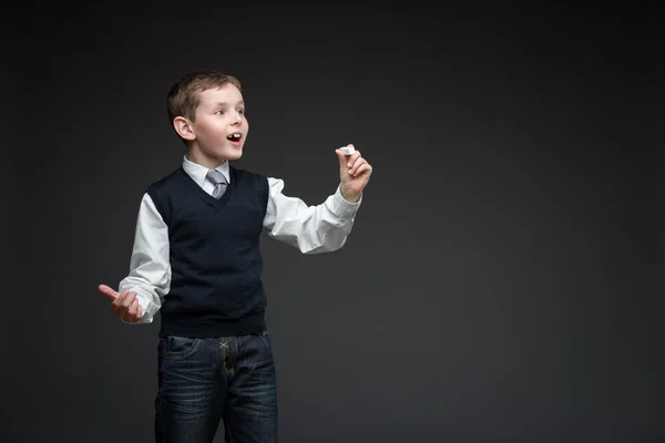 Little boy writing something with chalk — Stock Photo, Image