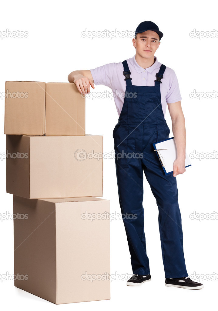 Young delivery man in overalls with packages