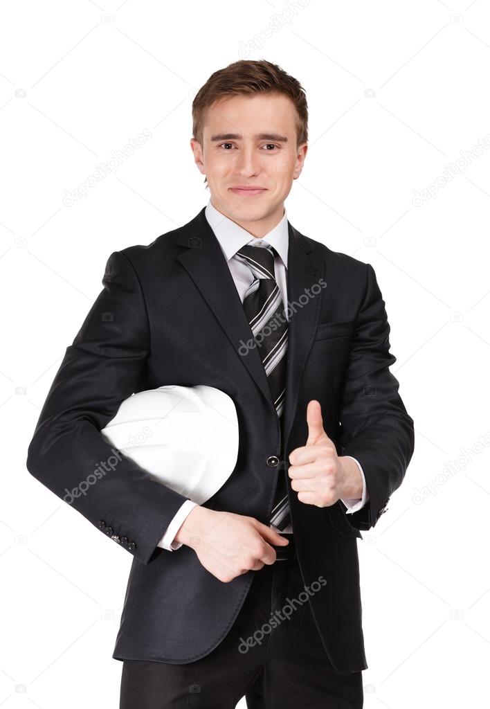 Businessman handing helmet in hands