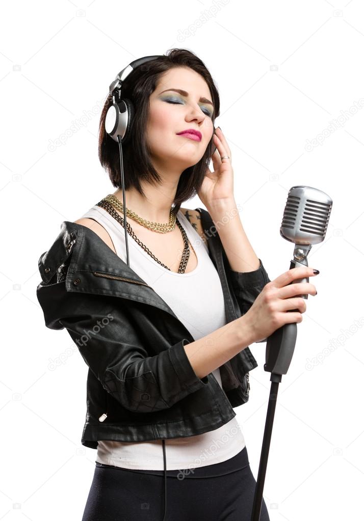 Rock musician with microphone and earphones