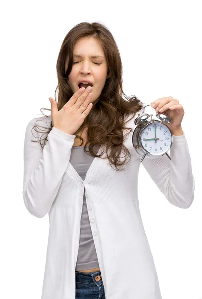 Yawning woman keeping alarm clock — Stock Photo, Image