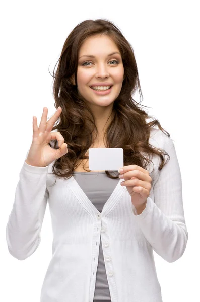 Woman keeping business card and ok gesturing Stock Photo