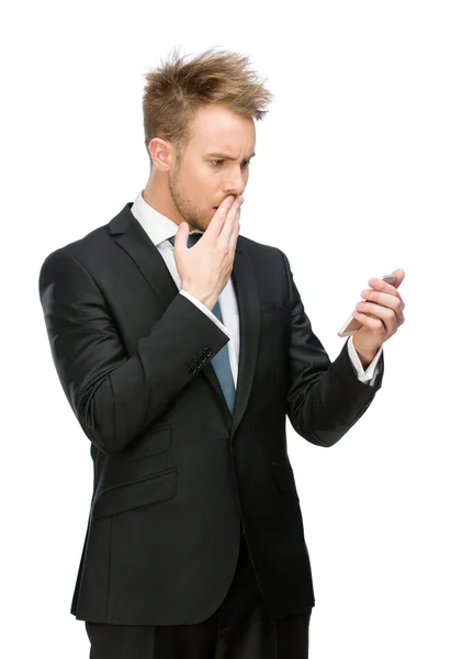 Businessman looking at cell phone — Stock Photo, Image