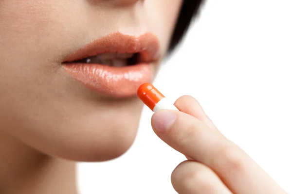 Close up of mouth and tablet — Stock Photo, Image