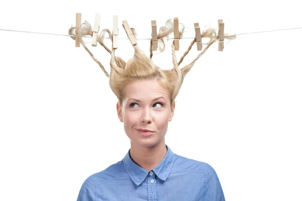 Woman with creative hairstyle of clothes pegs — Stock Photo, Image
