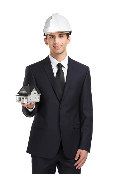 Businessman in hard hat hands model house — Stock Photo, Image