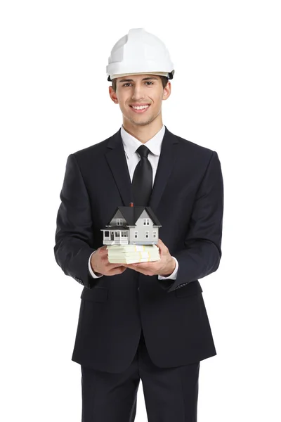 Real estate agent hands model house and cash — Stock Photo, Image