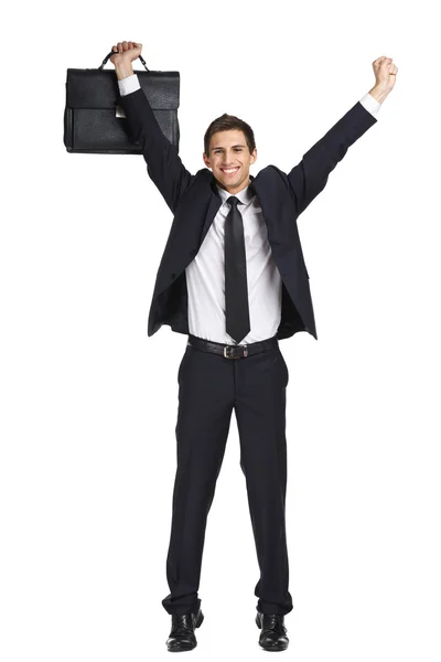 Бизнесмен с поднятыми руками, который держит портфель — стоковое фото