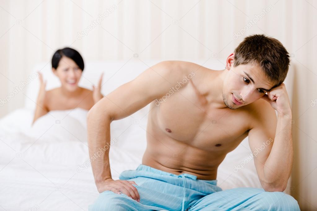 Married couple quarrels in bed