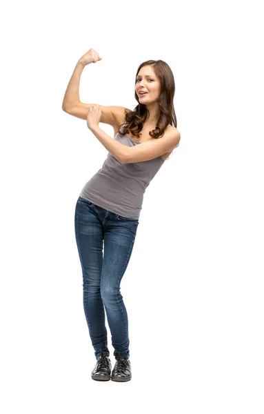 Full-length portrait of woman showing bicep — Stock Photo, Image