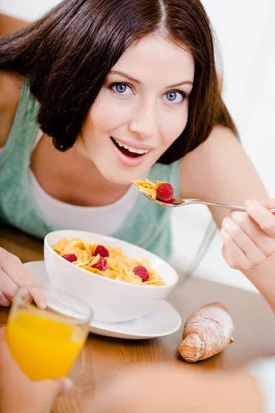 Girl eating light breakfast — Stock Photo, Image