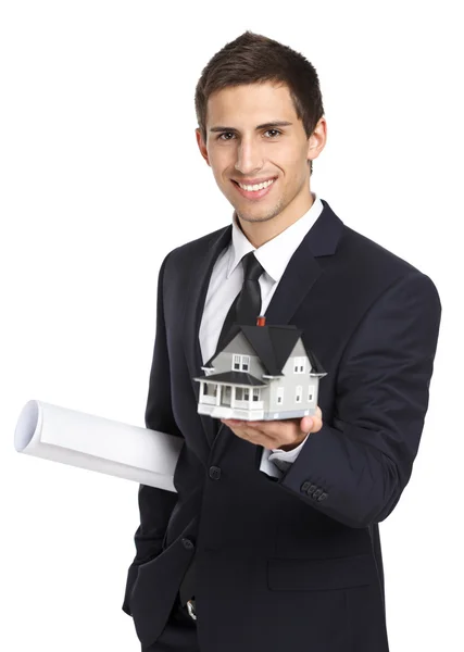 Businessman with model house and layout — Stock Photo, Image