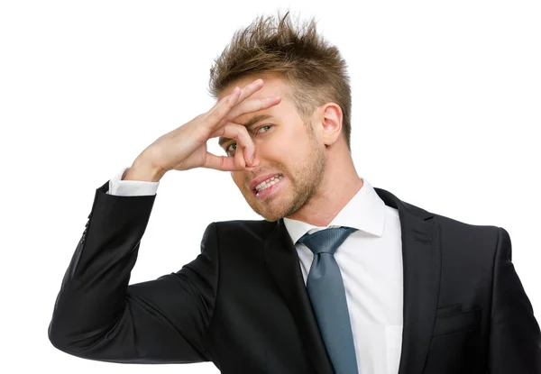 Business man covering his nose — Stock Photo, Image