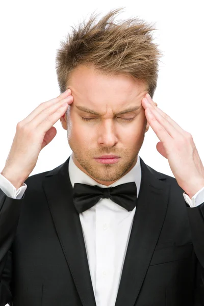 Executive with closed eyes putting hands on head — Stock Photo, Image