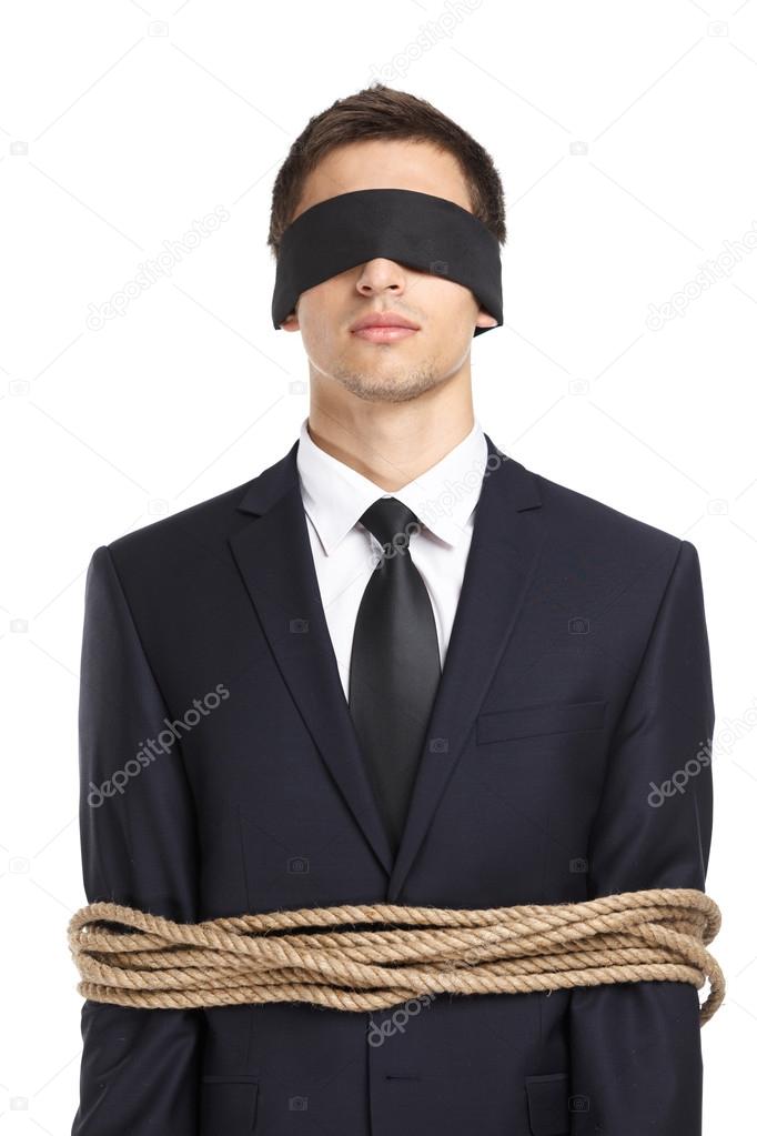 Blind-folded businessman tied with the line
