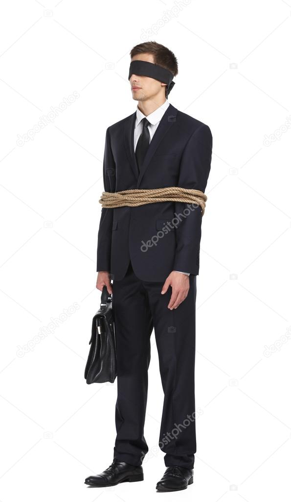 Blind-folded businessman tied with the rope