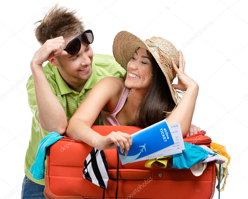 Couple packs suitcase