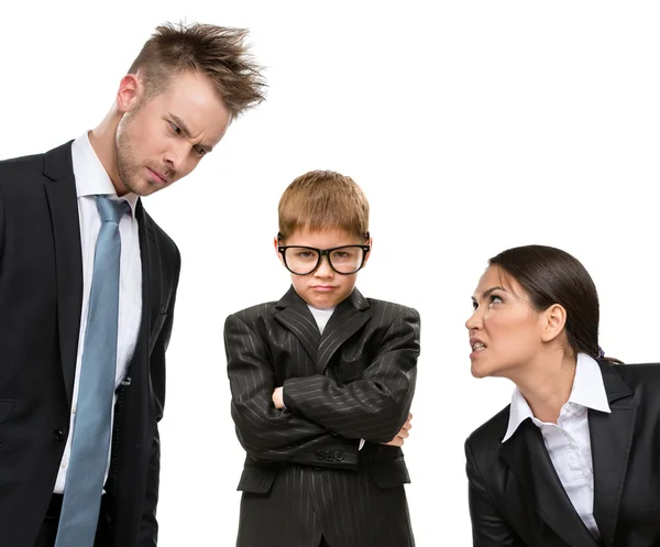 Little future businessman under pressure of parents — Stock Photo, Image