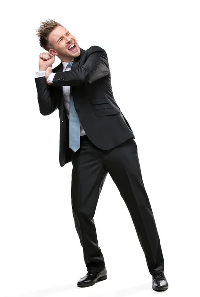 Full length portrait of businessman pushing something — Stock Photo, Image