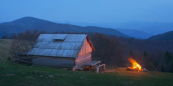 Bonfire near the house — Stock Photo, Image