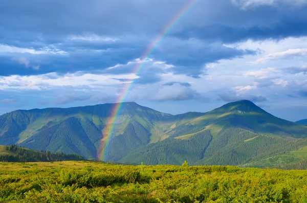 Rainbow in the mountains — Stock Photo, Image