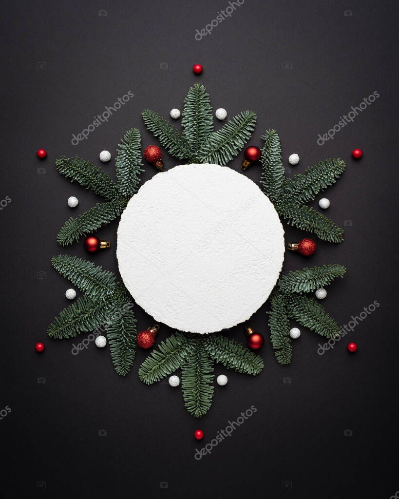 Christmas background with a decorative snowflake on black and note paper for text