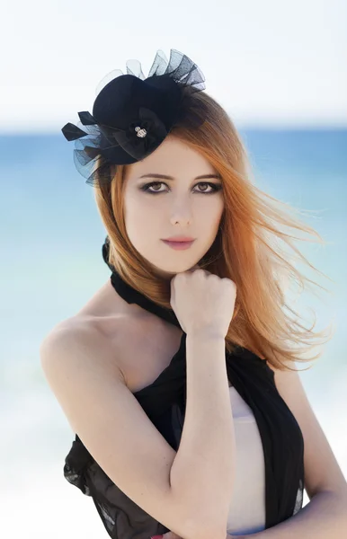 Fashion redhead girl in dress at the beach. — Stock Photo, Image