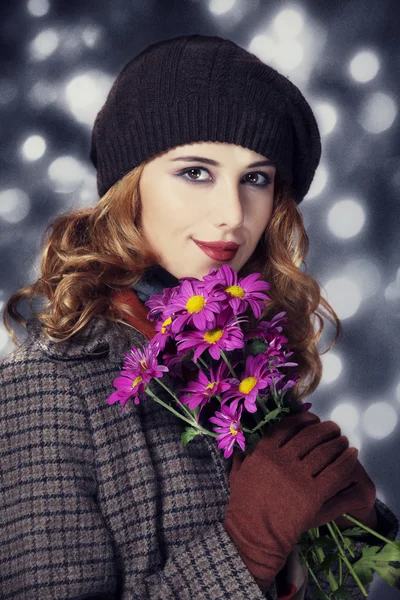 Happy style girl with flowers and bokeh at background. — Stock Photo, Image