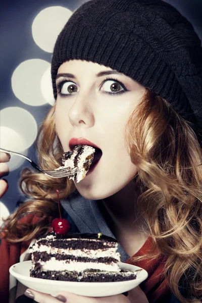 Style girl with cake and bokeh at background. — Stock Photo, Image