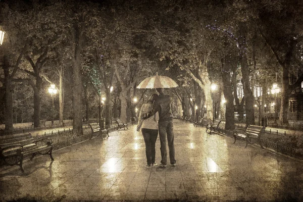 Couple walking at alley in night lights. Photo in vintage multic — Stock Photo, Image