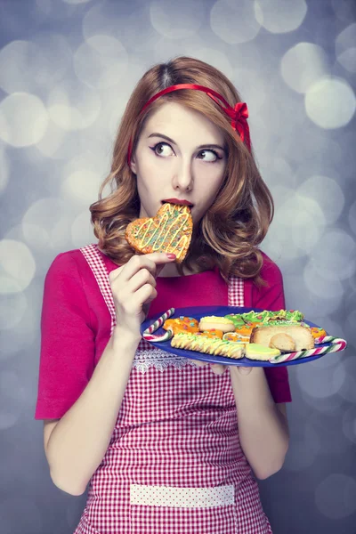 Redhead women with cookies — Stock Photo, Image