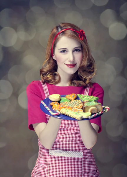 Redhead women with cookies — Stock Photo, Image