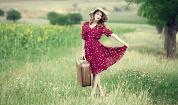 Redhead girl with suitcase at outdoor. — Stock Photo, Image