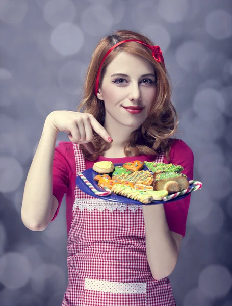 Redhead women with cookies — Stock Photo, Image