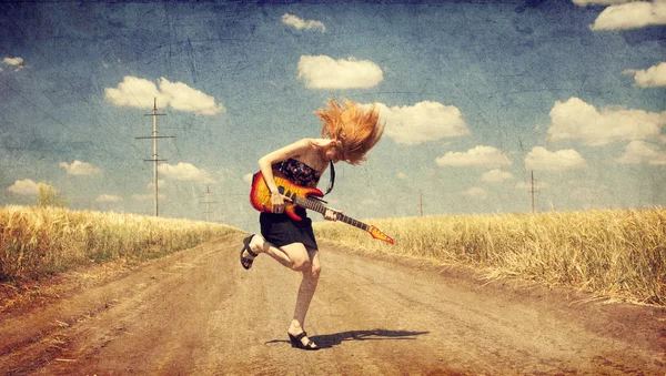 Red-head girl with guitar. Photo in old image style. — Stock Photo, Image