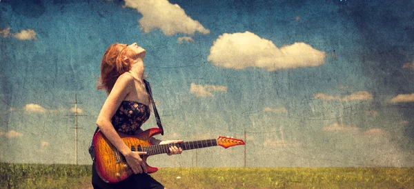 Red-head girl with guitar. Photo in old image style. — Stock Photo, Image
