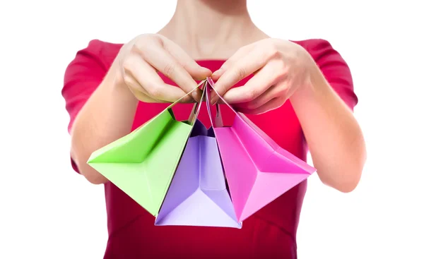Women in red dress with little shopping bags — Stock Photo, Image