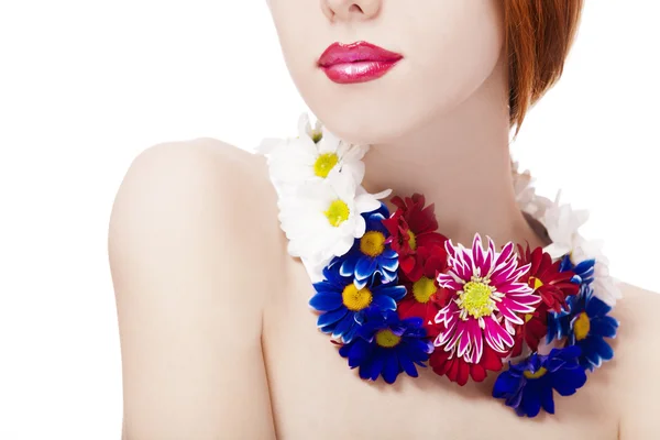 Beautiful redhead girl with flowers — Stock Photo, Image