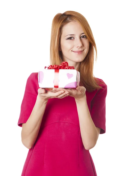 Red-haired girl in dress with present box at white background. — Stock Photo, Image