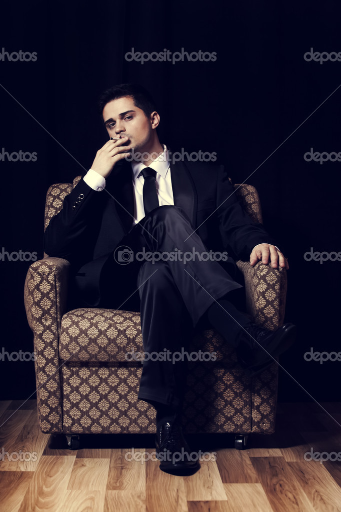 Man With Cigarette Sitting In Vintage Armchair Stock Photo Image By C Massonforstock Man With Cigarette Sitting In Vintage Armchair Stock Photo Image By C Massonforstock
