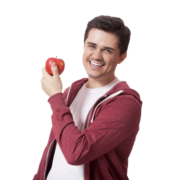 Young man in white shirt and with red apple — Stock Photo, Image