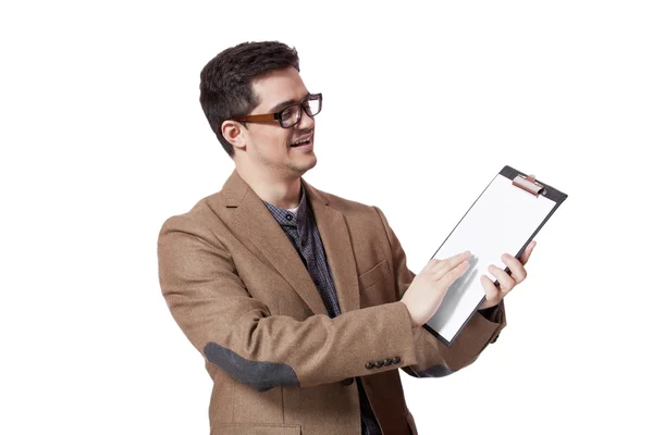 Young business man holding a clip board over white background — Stock Photo, Image