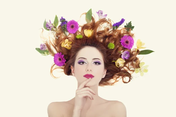 Beautiful redhead girl with flowers isolated. — Stock Photo, Image