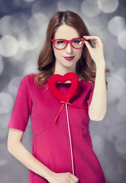 Beautiful redhead girl with two hearts. — Stock Photo, Image