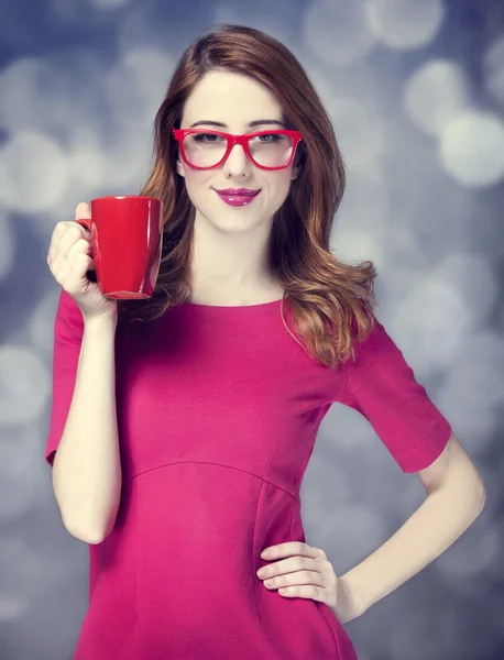 Redhead girl with red cup. — Stock Photo, Image