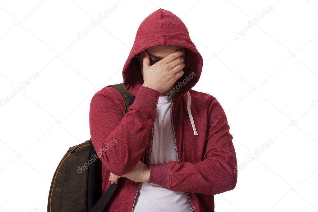 Young sad teenage boy isolated on white background